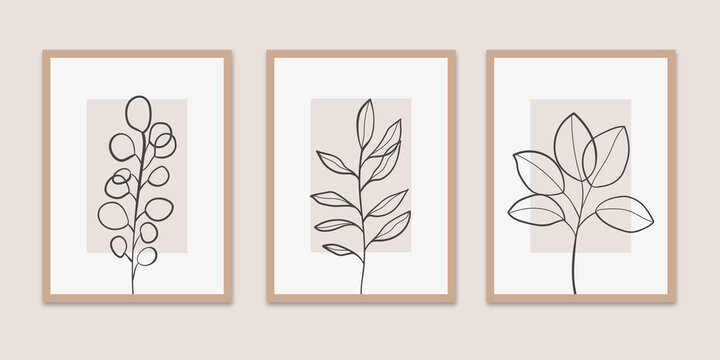 Set of three minimalist botanical wall art prints featuring black continuous line drawings of leaves and branches on beige rectangular backgrounds with thin tan frames in a triptych layout.