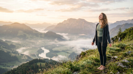 Naklejka premium Woman taking deep breaths of fresh morning air at mountain view perfect for mental health wellness and freedom concepts