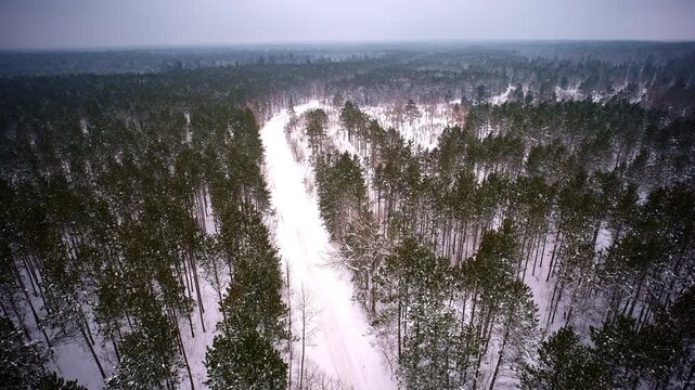 Drone shot flying over wintery landscape in the Upper Peninsula of Michigan after a big snow storm