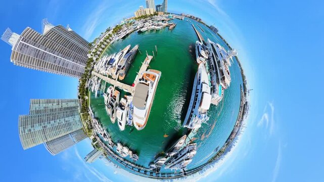 Tiny planet aerial video Miami Beach Marina with luxury yachts at docks