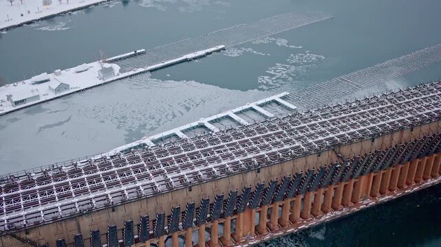 Drone shot of ore dock where iron ore is loaded onto freighters in lake superior in winter