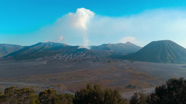 Aerial: Bromo-Tengger-Semeru volcano chain during the day in East Java, Indonesia, jib up drone shot