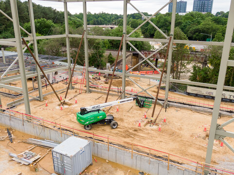 Articulating Boom Lift at New Red Hat Amphitheater Stage Construction Site