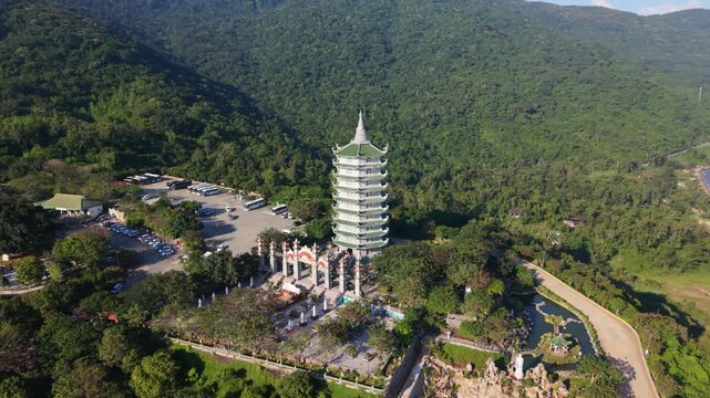 Vietnam, Da Nang Serene Pagoda Courtyard Nestled In Forest Near Danang Hills, Aerial Approach Reveals Pond Reflections, Stone Statues And Winding Paths, Quiet Spiritual Energy And Verdant