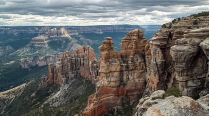 Fototapeta premium Scenic canyon viewpoint with layered sandstone cliffs and dramatic cloudy sky