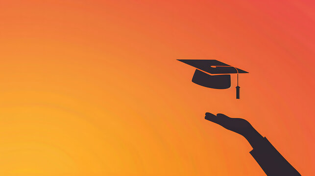 Silhouette of hand catching graduation cap on orange sunset background with copy space for education banner.