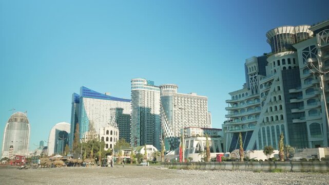 Orbi City view and Grand Gloria, fast flow of people on the embankment. Timelapse view of the famous buildings of Batumi, Georgia, Adjara region