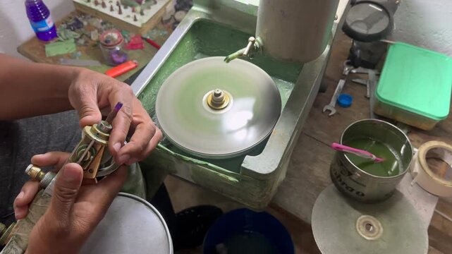 Close-up of making jewelry in a small workshop in Zambia.