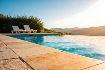 Fototapeta premium Modern luxury villa poolside with travertine tiles and clear blue water. Sunlit terrace with lounge chair, surrounded by tropical nature, perfect vacation relaxation lifestyle scene.