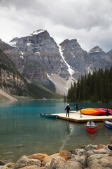 Obraz premium Aerial View of a Bright Light Blue Lake in Banff National Park in Canada on a Cloudy Summer Day
