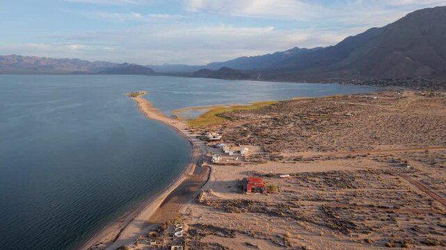 Discover Bahia de Los Angeles as sunlight casts shadows over the land and water in the late afternoon hours of Baja California
