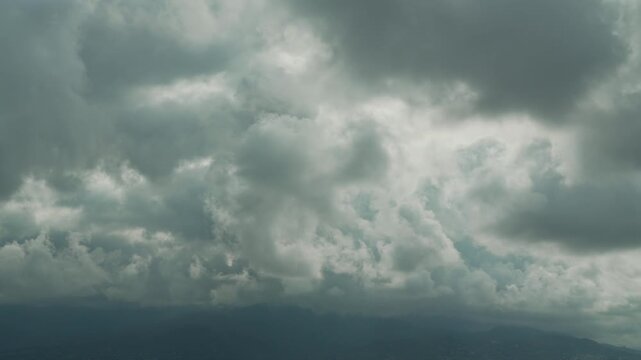 Storm warning, climate change, environmental protection. Timelapse of clouds sky are scudding over mountains. Problem of urban air pollution