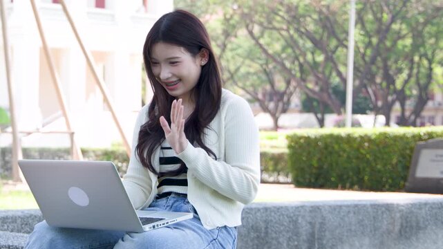 Asian University Student Having a Video Call on Laptop at Campus