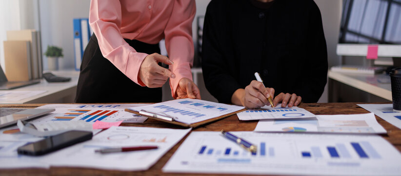 Team of Business people meeting to discuss the situation on the market. Business Financial calculating finance, tax, accounting, Concept