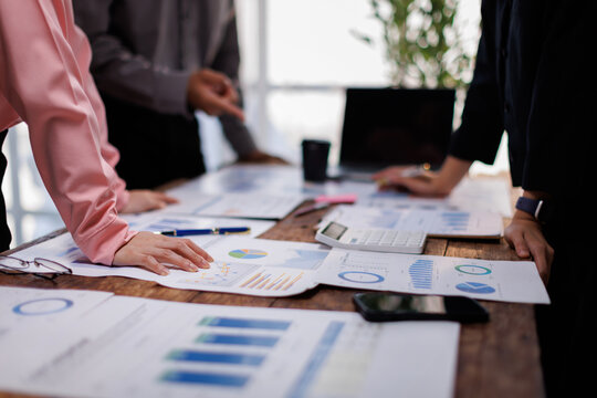 Asian business adviser meeting to analyze and discuss the situation on the financial report in the meeting room.Investment Consultant, Financial advisor and accounting concept