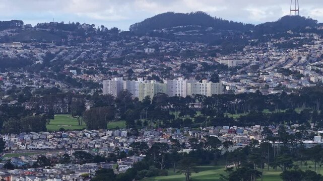 Drone views reveal Daly City&rsquo;s mix of homes and manicured golf greens, showcasing rolling terrain, patterned streets, and the soft coastal atmosphere of this Northern California setting