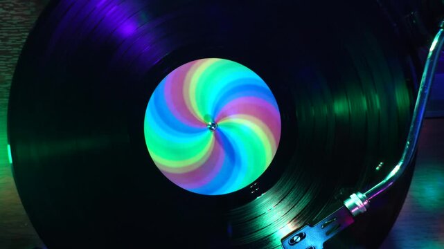 Vinyl Record Playback in Colorful Disco Lights, Top Down View