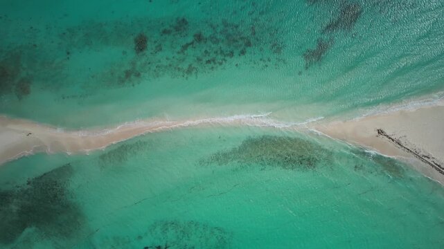 drone view over turquoise waters and white sandbar of Cayo de Agua in Los Roques Archipelago, Venezuela. Tropical Caribbean seascape with crystal clear water and pristine natural tropical beach