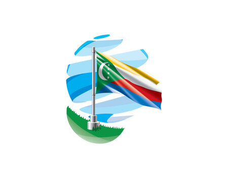 Comoros flag on a green lawn against a background of blue abstract sky