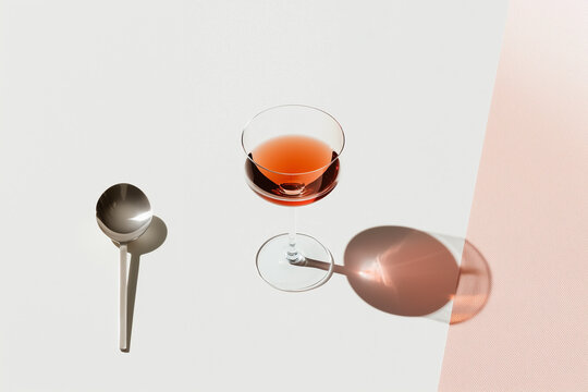 Pink beverage demonstrating minimalist textural study with translucent liquid