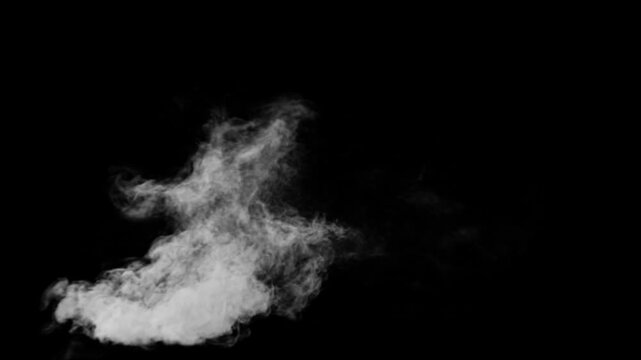 Rising smoke plume. Single smoke plume on black background