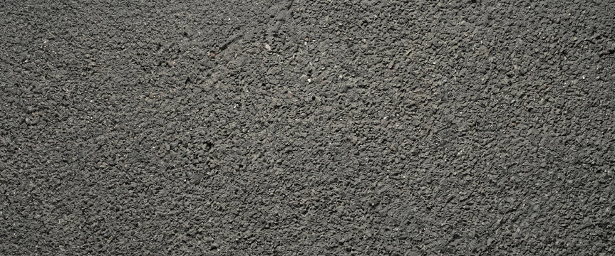 A close-up view of a textured surface that appears gray and is characterized by a fine pattern or grain. Suitable for backgrounds or abstract designs.