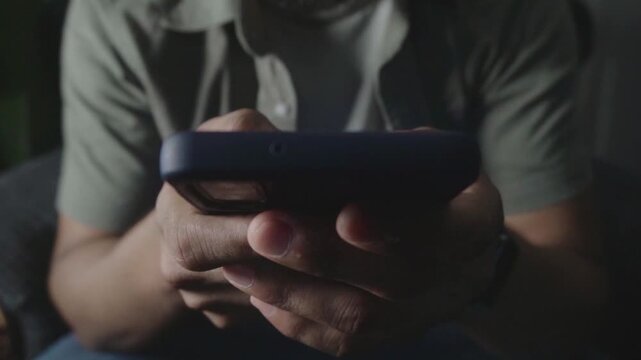Person scrolling online banking app on smartphone
