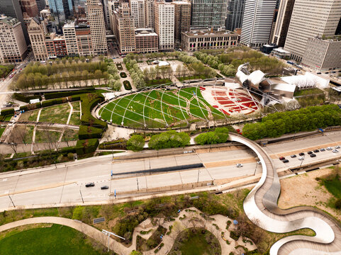  Aerial Drone View of Millennium Park, Jay Pritzker Pavilion and BP Pedestrian Bridge, Chicago, Illinois, USA