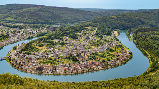 Panoramic aerial drone view of green hills, french old village, Meuse river meandering, Ardennes mountains nature landscape, Montherm&eacute;, Ardennes, France