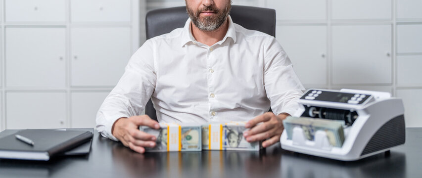 Bank operation, loan. Business solution. Businessman working in exchange office. Money counter. Money counting machine. Economic wealth and value investing