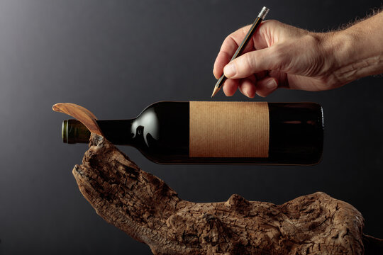 Bottle of red wine with empty label.