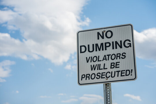 no dumping sign with sky background