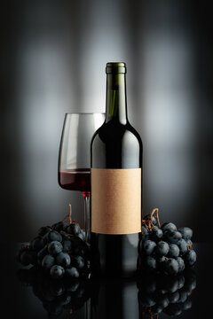 Red wine and juicy blue grapes.