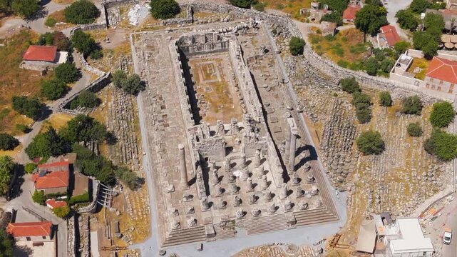 Didim, Turkey. Aerial drone view of the Temple of Apollo at Didyma, showing its vast stone platform, rows of Ionic columns, and surrounding ruins under bright summer sunlight.. Aerial View, MasterSho