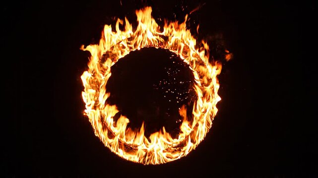 Circular fire ring burning against dark background with glowing embers inside