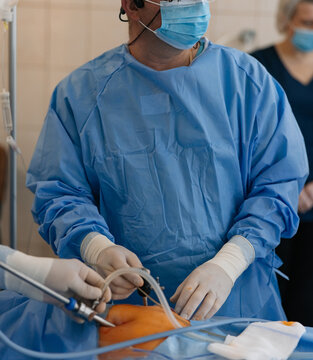 Close-up of laparoscopic instruments during abdominal surgical procedure