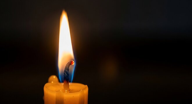 Burning candle flame isolated