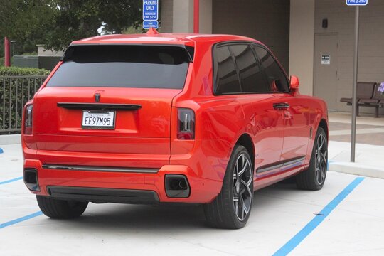 Rolls royce cullinan suv parked at movie theater
