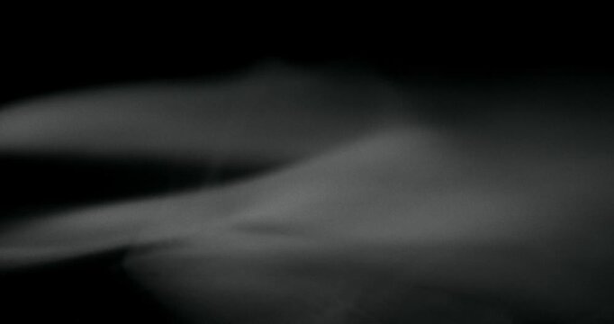 White water vapor drifting and flowing effect against a black background