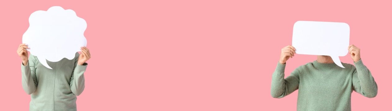 Young people holding blank speech bubbles on pink background with space for text