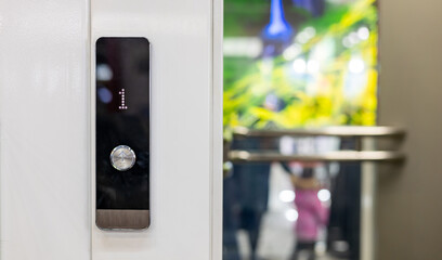 Closeup of elevator buttons in a modern setting, highlighting sleek design and convenience © NastyaPhoto