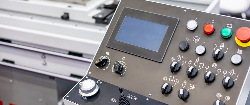 Control panel and buttons of the CNC machine. Industrial concept. Manufacturing CNC professional lathe machine.