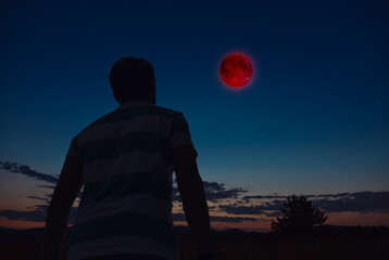 Fototapeta premium Amateur astronomer observing stars, planets, Moon eclipse and other celestial objects.