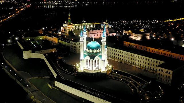 Kazan, Russia. Kul Sharif Mosque, four soaring minarets and turquoise dome illuminated against the night sky, aerial orbit over the Kazan Kremlin. Drone footage, Point of interest