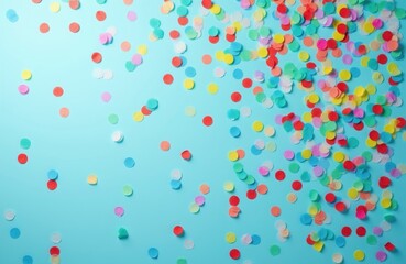 Naklejka premium Scattered colorful confetti dots on a bright blue studio background. Festive elements for parties, celebrations, and holidays. Space for text and design elements.