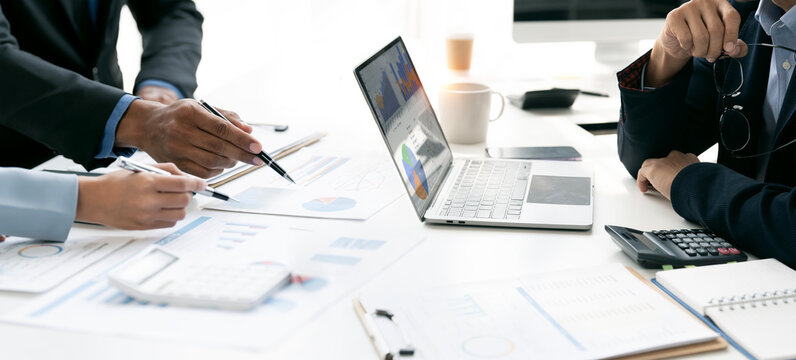 Business Professionals Analyzing Financial Data and Reports