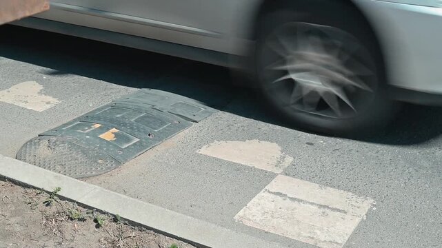 Close-up of broken speed bumps and road markings on the road, designed to slow down vehicles