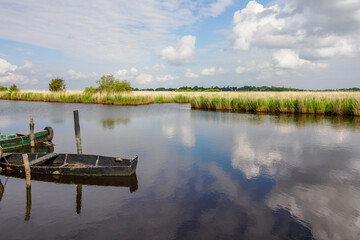 Abandoned barge on the banks of the Rozé Canal in Brière, France © serge