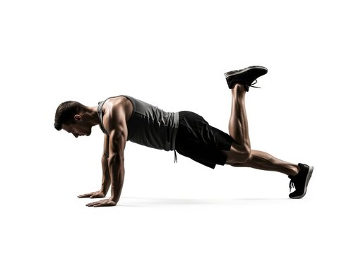 A man in athletic apparel performs a dynamic leg lift exercise, strengthening core muscles and promoting overall physical fitness with a focus on muscular engagement and body control during his