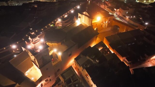 Drone shot of the Cathedral of the Assumption at night. illuminated baroque architecture of the Gozo Cathedral, located in the heart of the ancient Cittadella, Malta